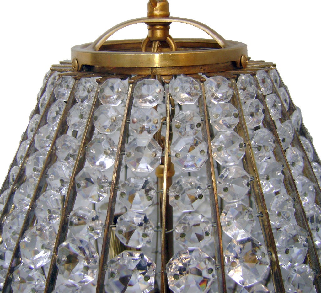 A 1930s French gilt metal and crystals lantern with three interior lights. Original finish.

Measure: 15