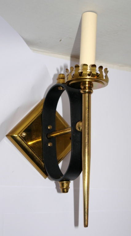 A pair of Italian circa 1950s sconces, single arm, bronze in gold and black tones. Diamond shaped backplate.
 