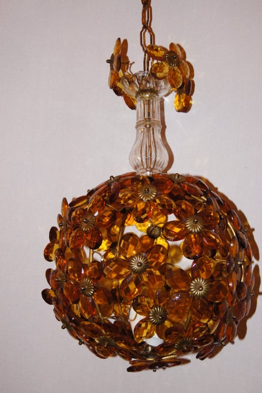 A circa 1930s French lantern with amber colored glass leaves and two interior lights.

Measurements:
Minimum drop 19