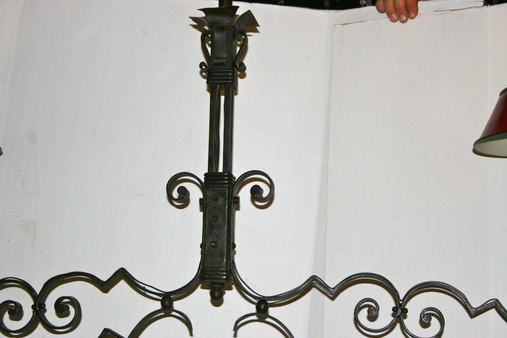 A circa 1920's French eight-light wrought iron billiard fixture with tole shades.

Measurements:
Height: 38