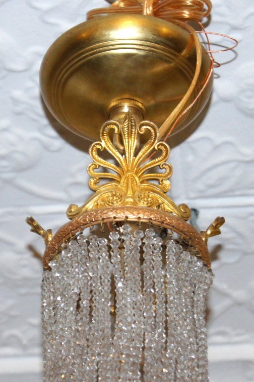 20th Century French Gilt Bronze and Crystal Chandelier For Sale