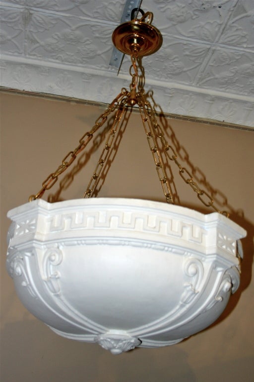 Pair of 1930s French neoclassic style plaster light fixtures with interior lights.

Measures:
Height 37 