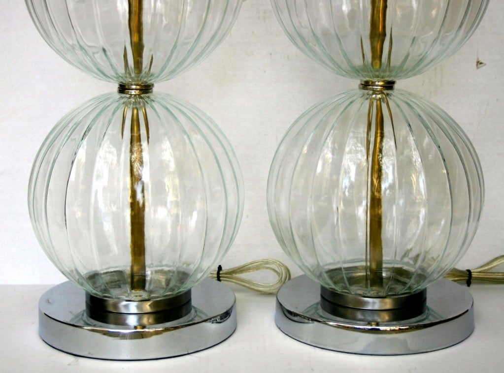 A pair of 1960s French molded glass table lamps.

Measurements:
Height of body: 20.5