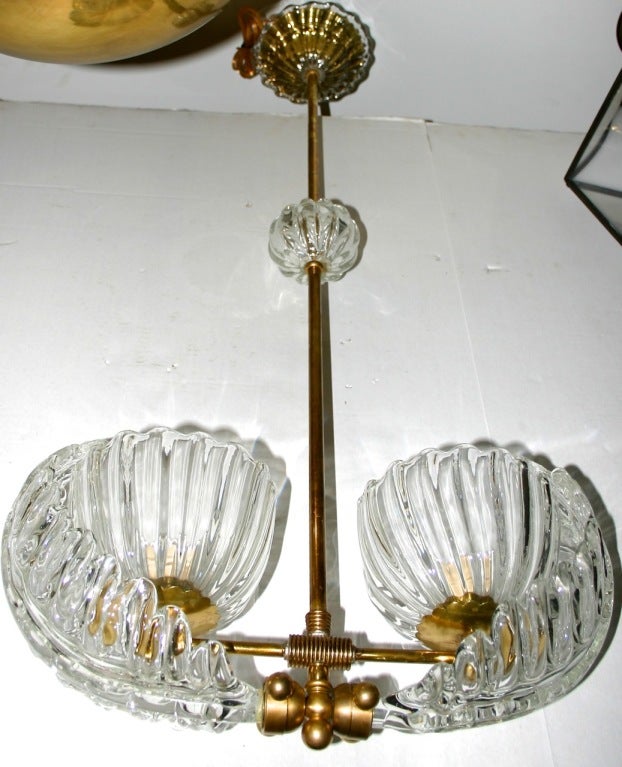 A Venetian glass light fixture with 2 lights, circa late 1940s.

Measurements:
Height: 38? drop
Depth: 6.5?
Length: 17.75?.