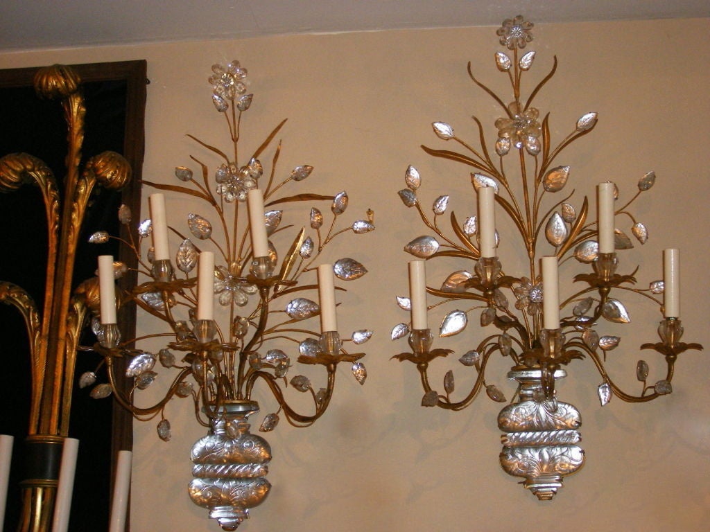 Pair of large gilt metal sconces with molded glass leaves and flowers. Shaped like an urn with branches of flowers.
Five lights each.