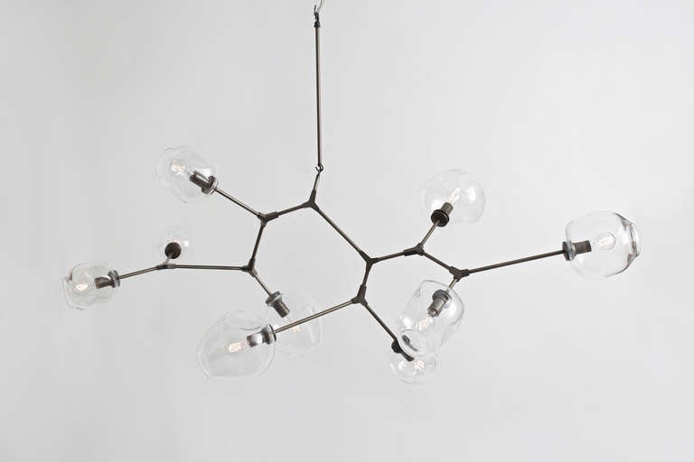 9-globe branching bubble.  $2500/bulb - includes white or clear glass globes and pods, porcelain discs, walnut shades and 6