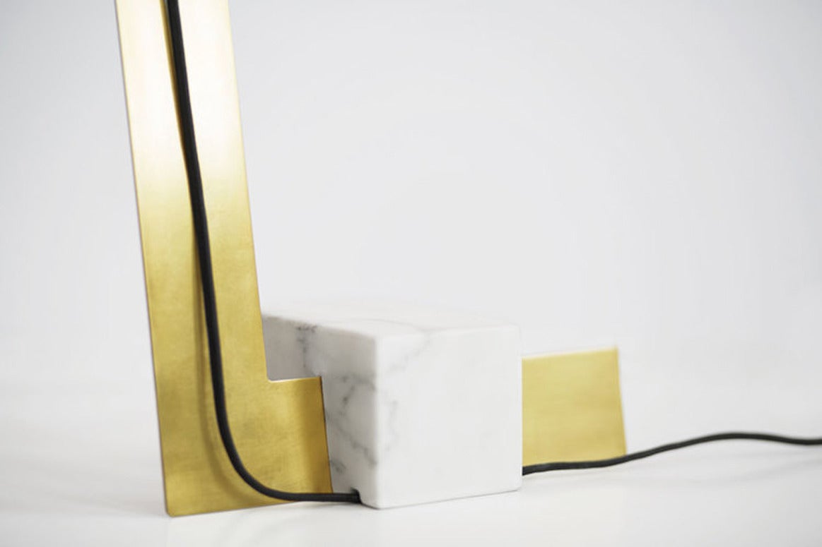 Clark Table Lamp by Lambert et Fils
The table lamp has a natural brass finish with a white marble base. 
Wire is black.