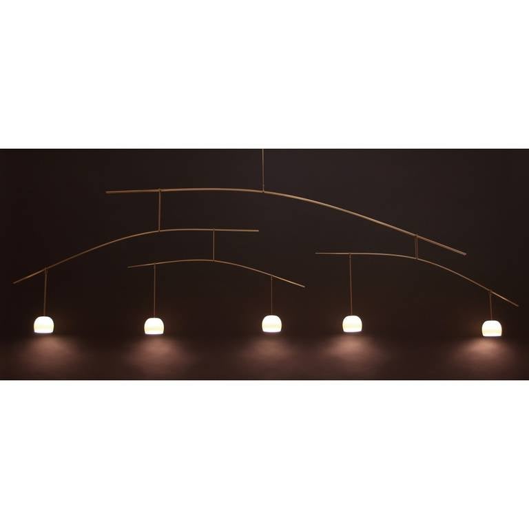 Solid brass rods and ceramic shades. Custom options available.

Illumination:
Five 20 watt Xenon light bulbs. Dimmer compatible.

Drop to specifications.