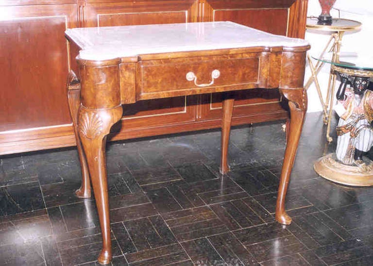 Late 19th century walnut side table, gray marble top outset corners, drawer in apron on shell carved cabriole legs, slipper feet.