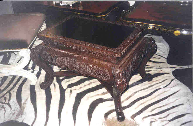 Late 19th century carved cocktail table inset carved top, gadrooned molded edge, cabriole knee scrolled feet.