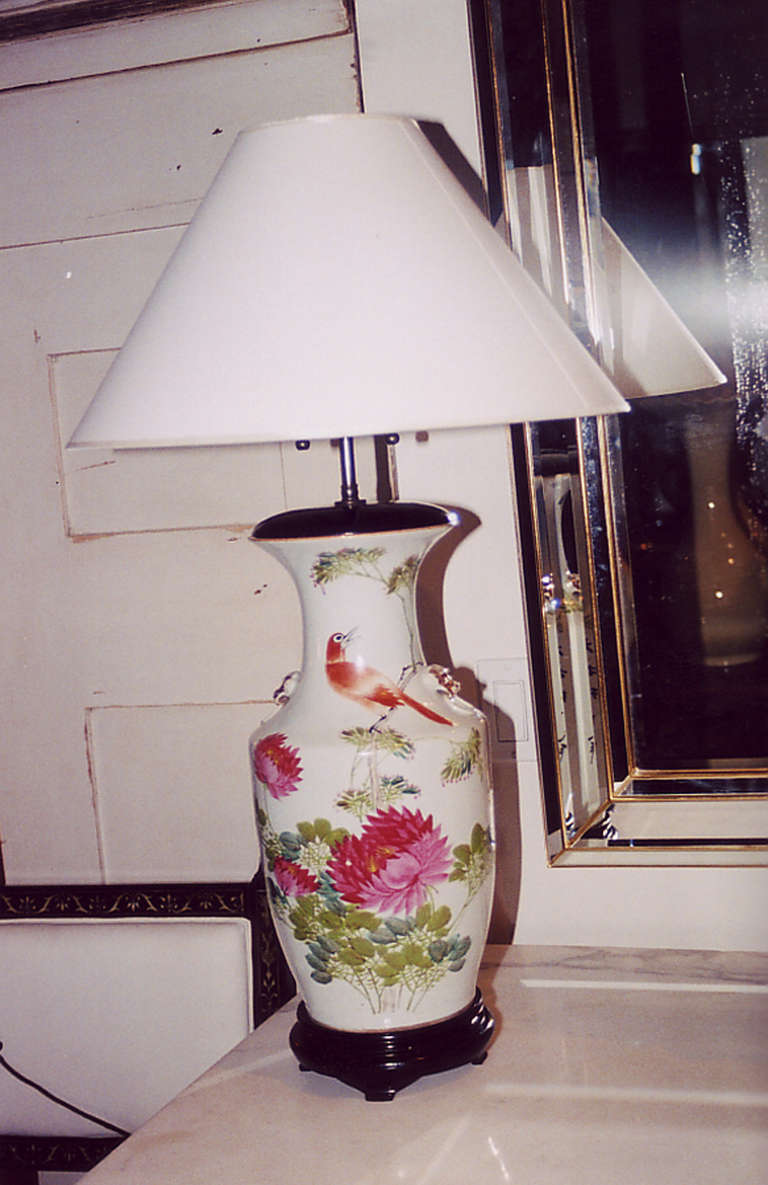 19th century vase shaped porcelain lamp with peonies decoration on hardwood base.