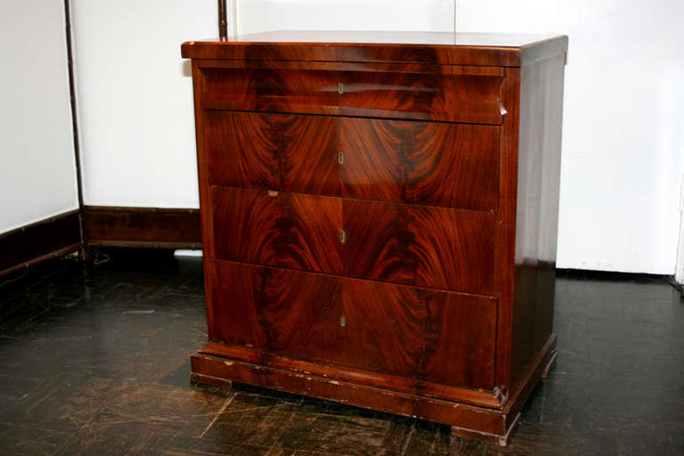 19th century mahogany commode, molded polished top above four drawers, block feet.