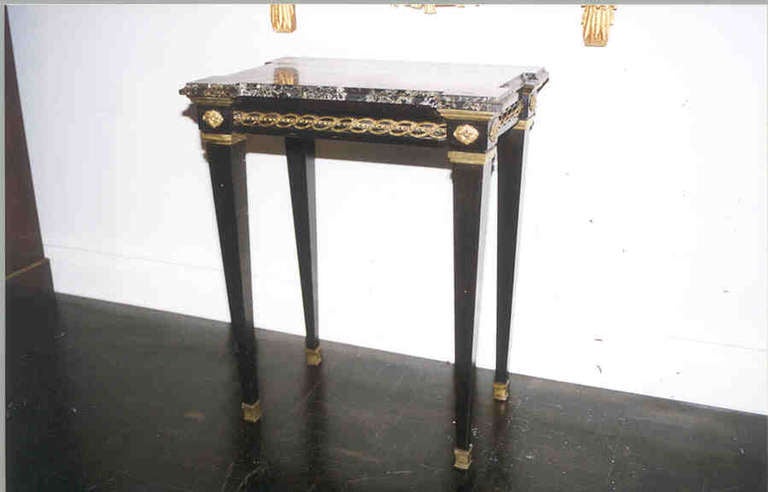 Napoleon III ebonized petite console table, black and beige marble top, break fronted sides, applied guilloche banding on apron.