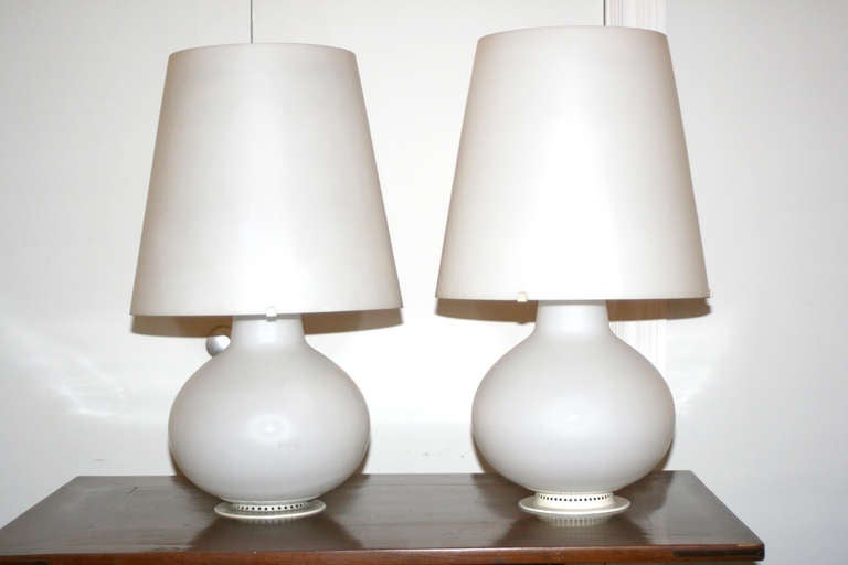 20th Century matched pair of white glass lamps with glass shades, bulbous shaped bodies.