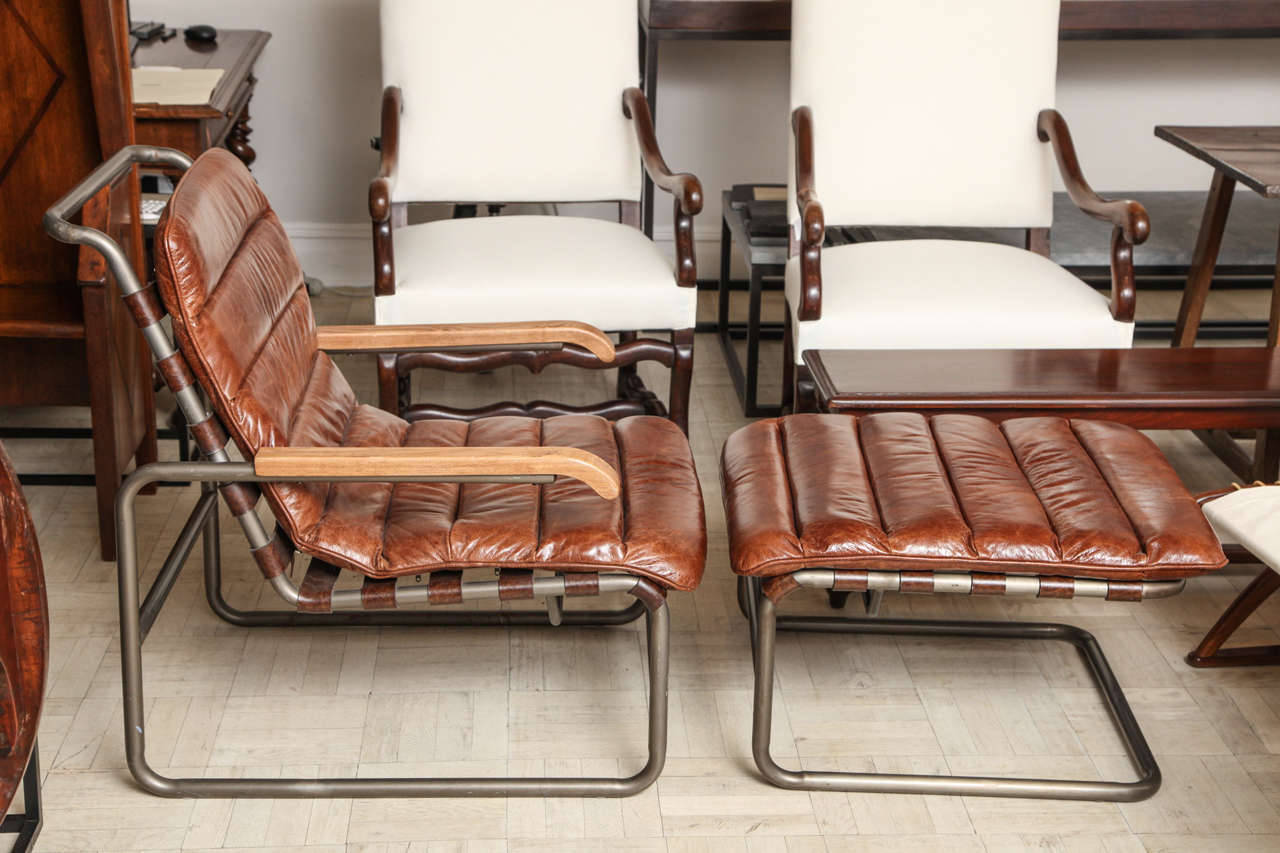 20th Century tubular steel chair and ottoman, upholstered in leather

