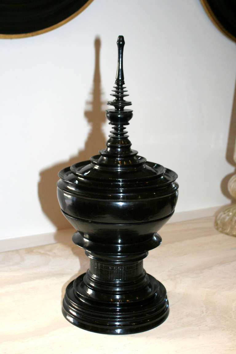 Early 20th Century Burmese black lacquer special ceremonial offering vessel. Detailed spire form the top of the lid, with inner offering plate, stepped curved ring molded bowl above round base