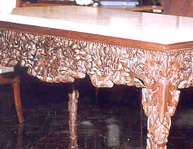 Padouk wood center table with marble top, carved apron with dragon mask, scaled cabriole legs.