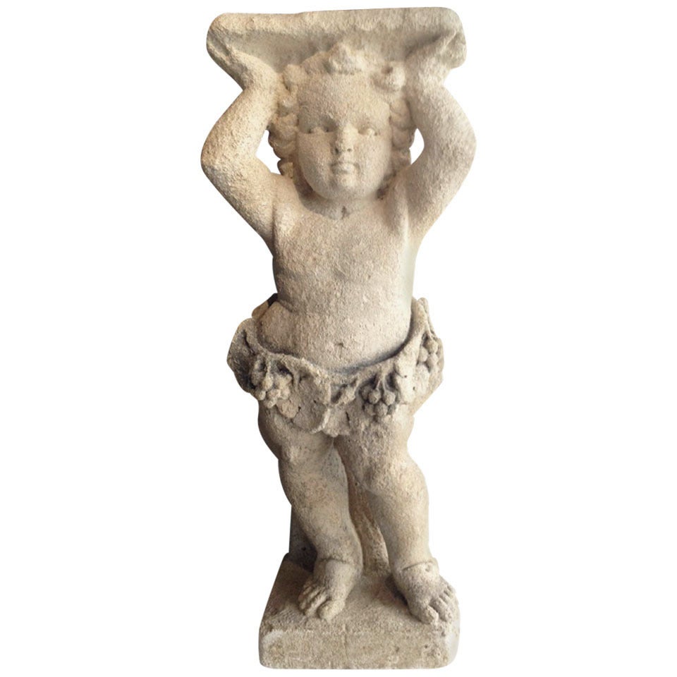 Carved Stone Figure of a Cherub Pedestal For Sale
