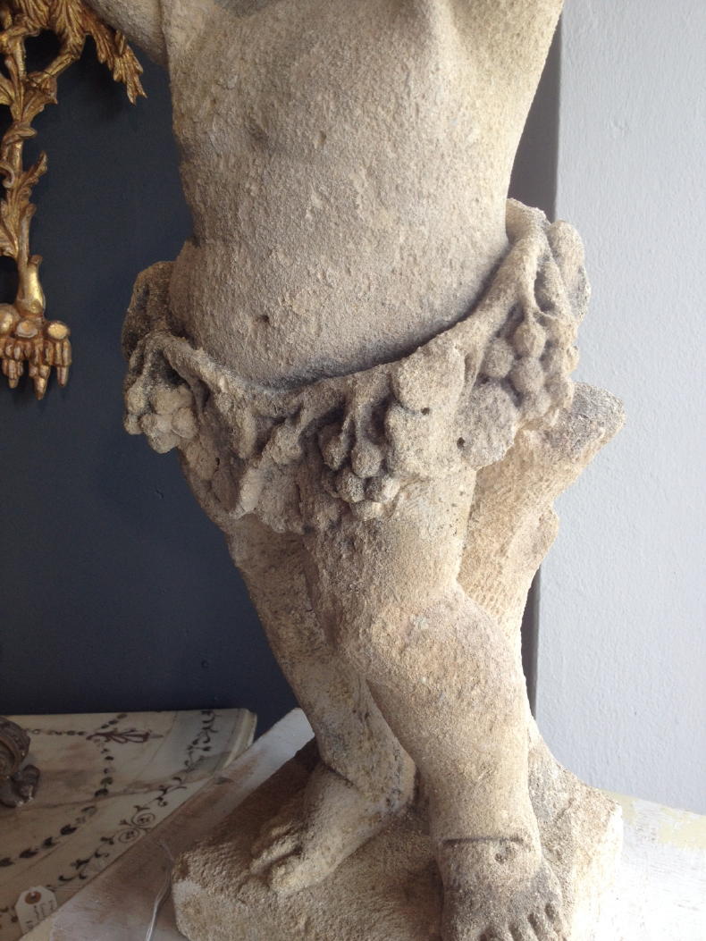 European Carved Stone Figure of a Cherub Pedestal For Sale