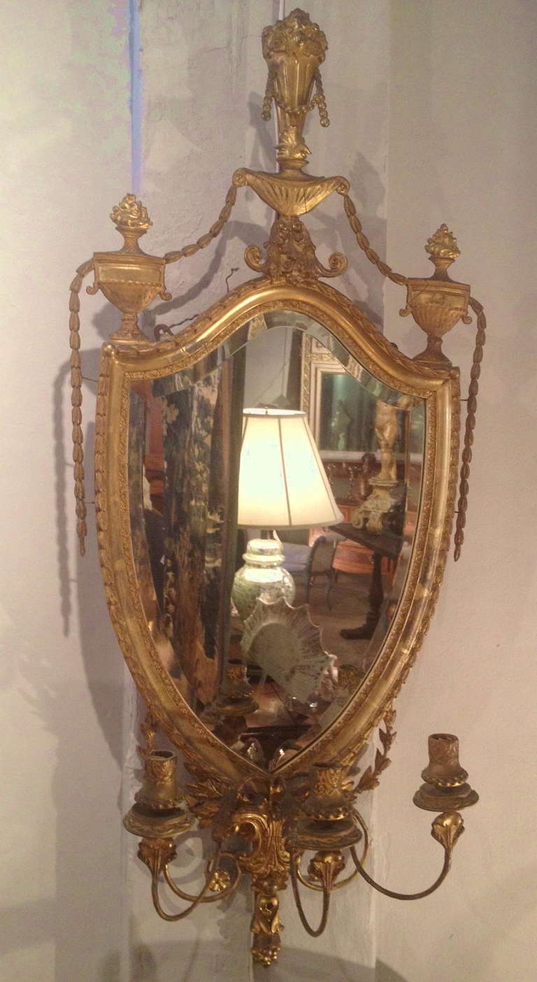 19th Century American Adam Style Gilt Wood And Gesso Shield Back Girondole Mirror With Three Candle Holders.