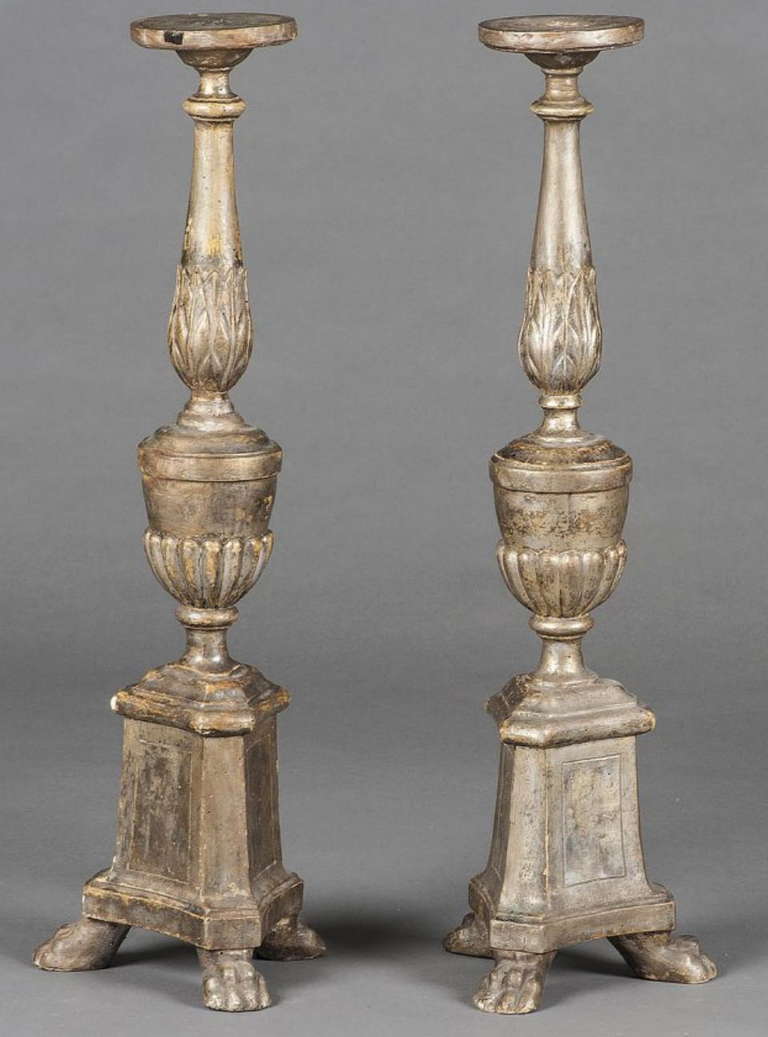 A Pair Of Silvered Pricket Candlesticks