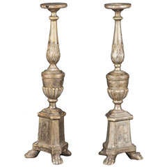A Pair Of Silvered Pricket Candlesticks