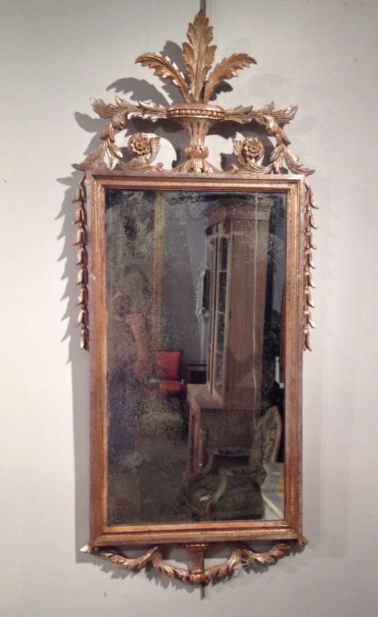 A Pair Of Early 20th Century Italian Silver Gilt Mirrors With Carved Wood Decoration All Around And Distressed Mirrors.