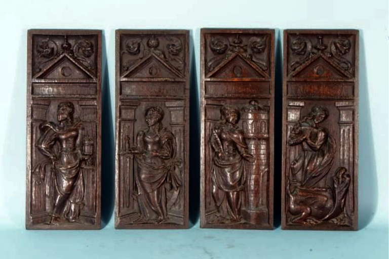 A Rare Set Of 4 16th Century Gothic Carved Oak Panels. Now Mounted In Iron Frames On Stands Which Can Be Removed To Hang On A Wall. Depicting Mary Magdalene With Jug Of Ointment, Catherine Of Alexandria, With The Sword, Barbara With The Tower And