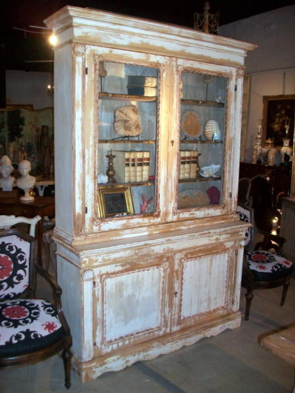 A Wonderfully Distressed Italian Carved And Painted Bookcase Cabinet.