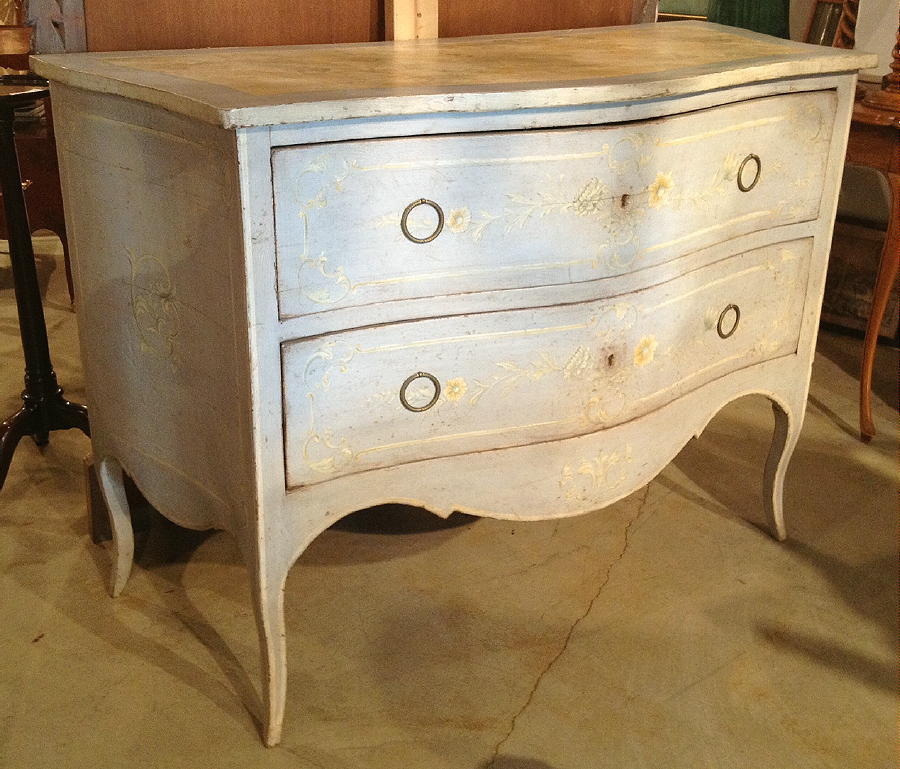 A Venetian paint decorated two drawer chest.