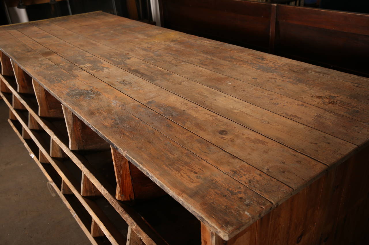 Vintage Industrial Hardware Store Counter. This counter has three shelves to provide plenty of storage for multiple uses. Box dimensions are 17