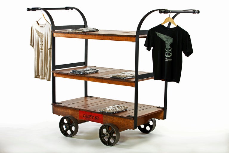 Vintage Industrial Wood, Cast Iron, Metal & Steel Factory Machine Age Rolling Display Cart, Rack Has Three Shelves Measuring 48" x 28" and is set on 10" Cast Iron Wheels. Great For Clothing in a Retail Location. (Quantities and