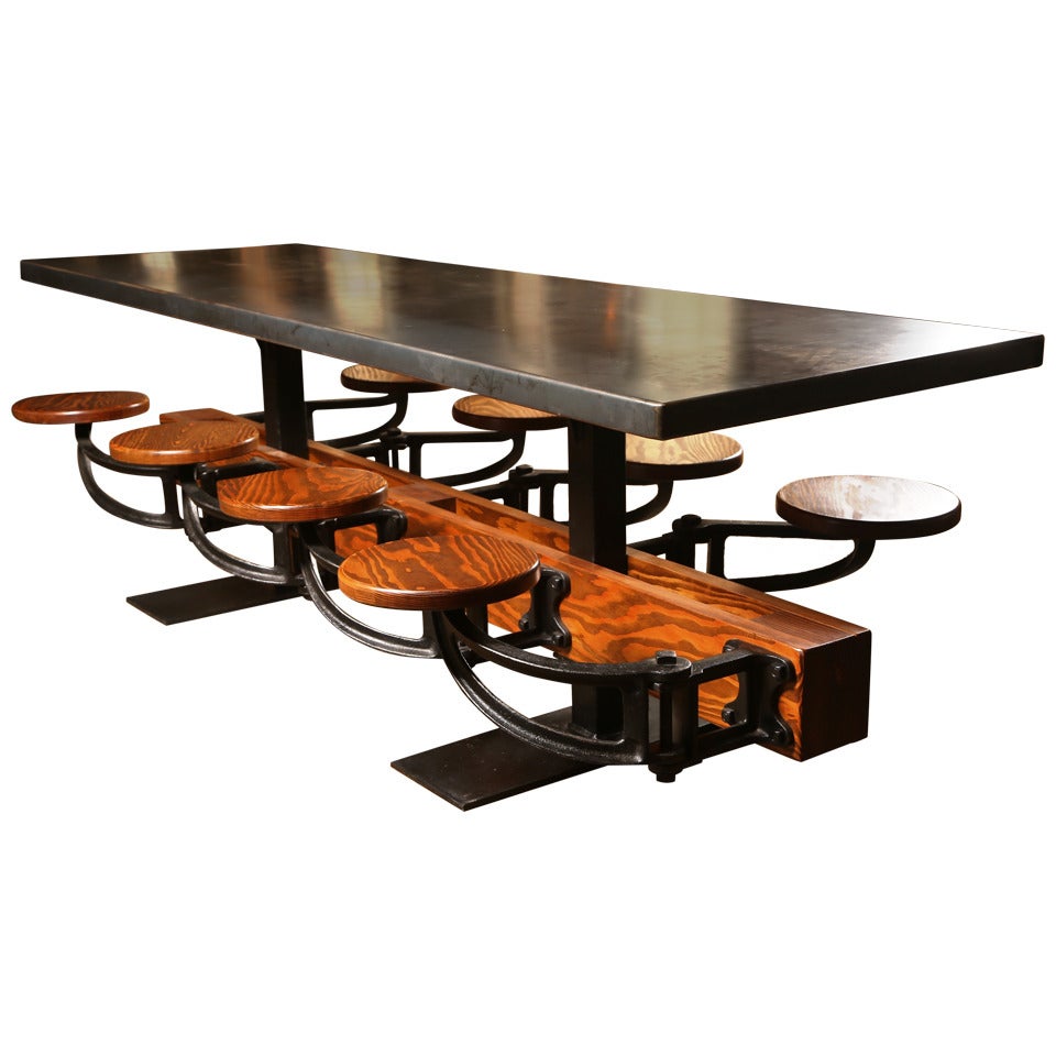 Eight Seat Communal Steel Top Dining Table with Cast Iron Attached Swing Seats For Sale