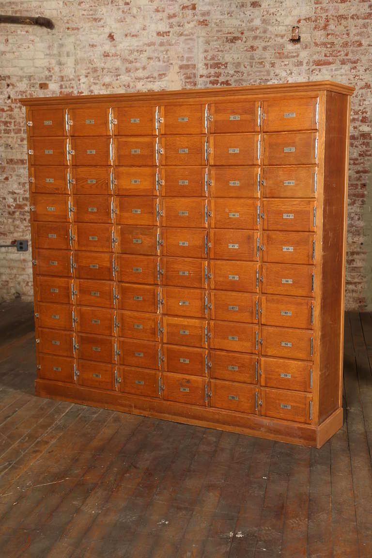 Beautiful Vintage Industrial Wood Storage Cabinet. Pigeon Hole or Locker Style with Numbered Doors and Metal Hardware.