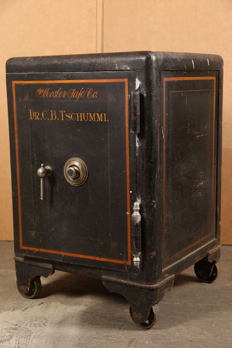 Vintage industrial cast iron Mosler safe. By the Mosler Safe Co. Safe is painted 