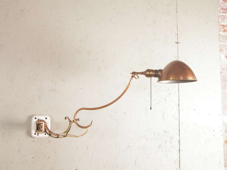 Faries Adjustable Wall Dental Lamp or Sconce. Great Copper over Brass patina. Great condition.  Lamp length from wall is 37.5