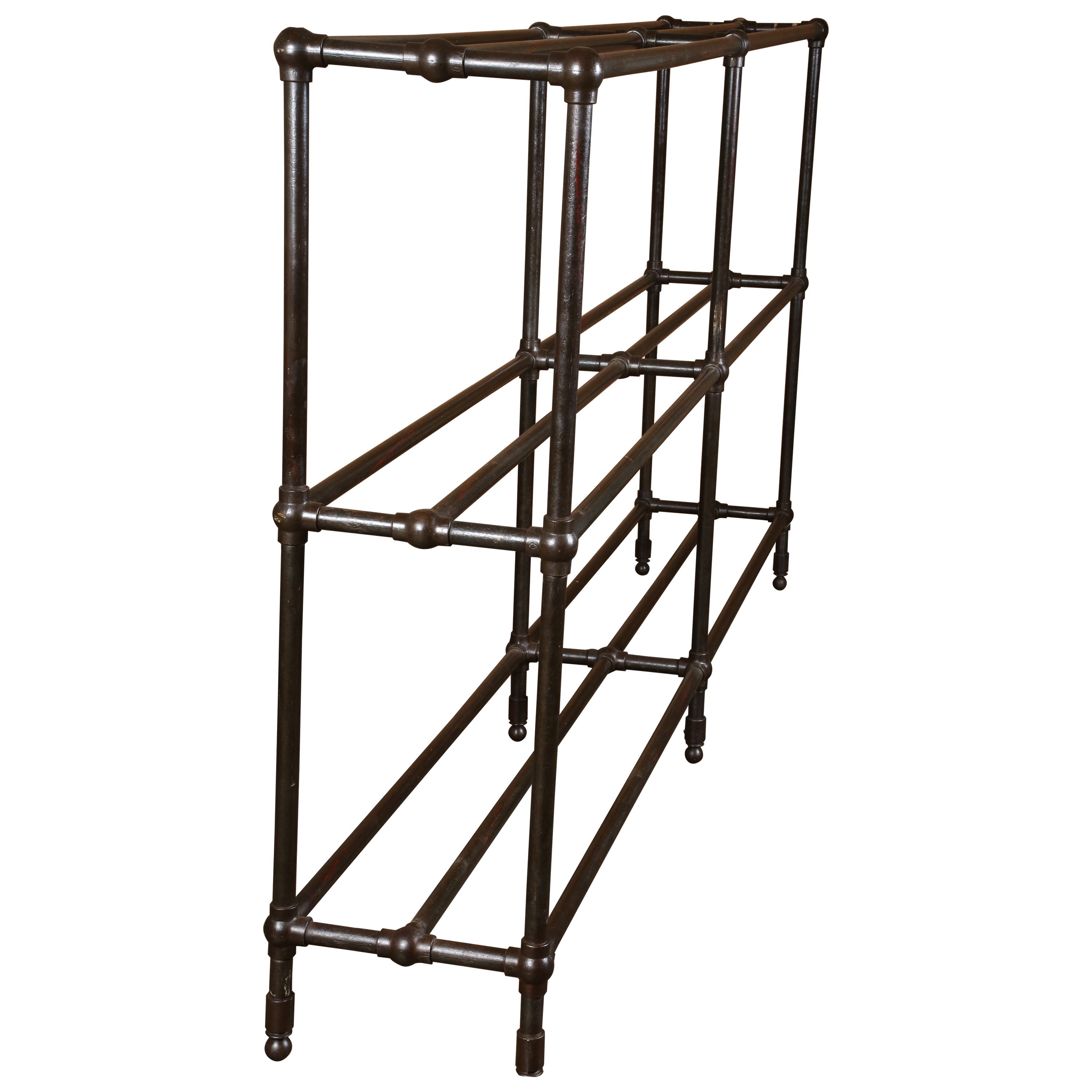 Vintage Industrial steel pipe shelving unit with steel poles and cast iron ball joints. 