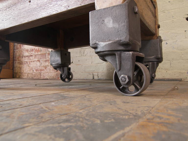 Wood, Steel and Cast Iron Turtle Table on Castors. Top measures 27 1/2