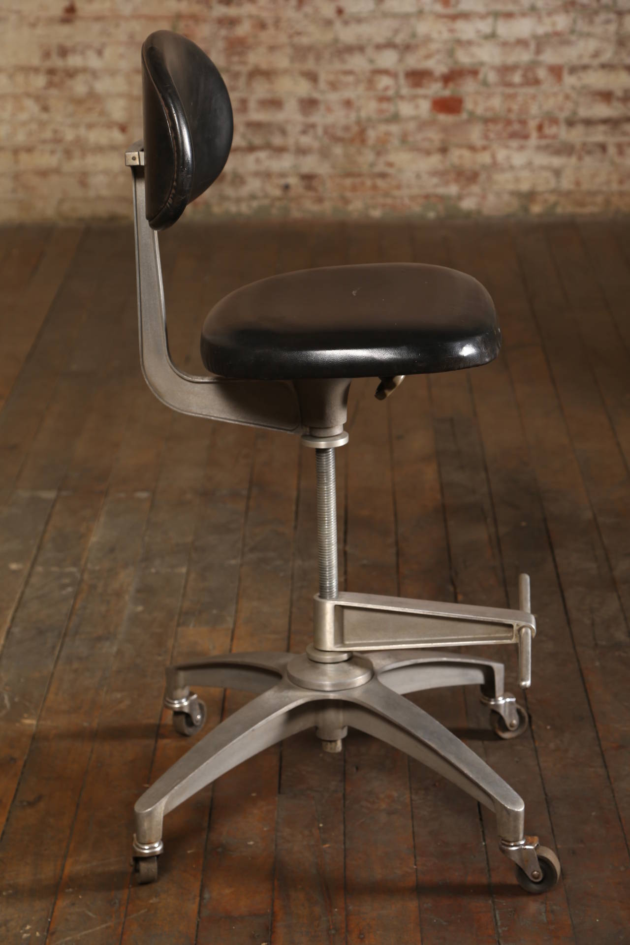 Original Vintage Furniture. Shaw Walker Drafting Stools. Black Vinyl Seat/Back Rests with Metal Frames on Wheels.