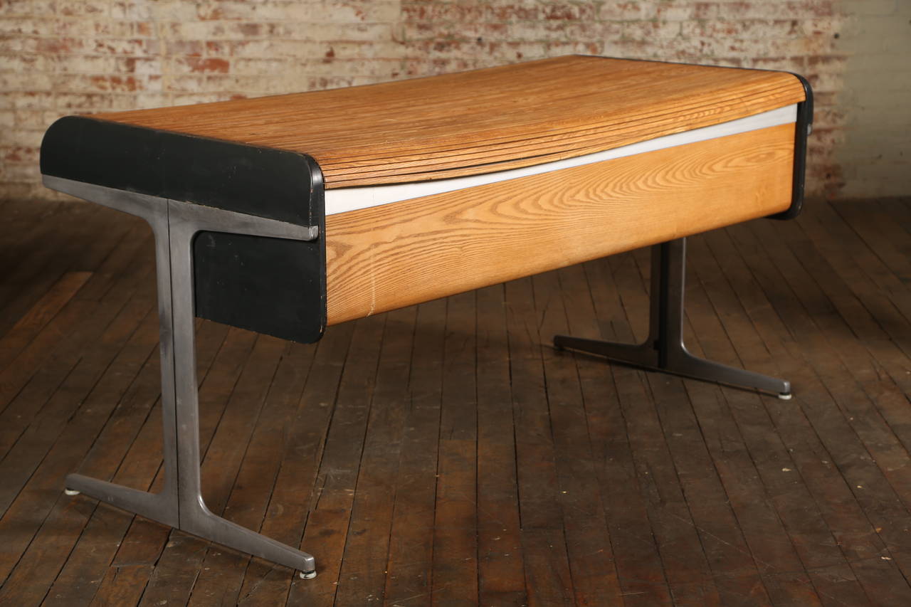 Mid-Century Modern action office roll top desk by George Nelson & Herman Miller. Desk top rolls back to show great work space with four drawers. Polished aluminum, oak tambor. Concept: Robert Propst - Design: George Nelson. Item includes
