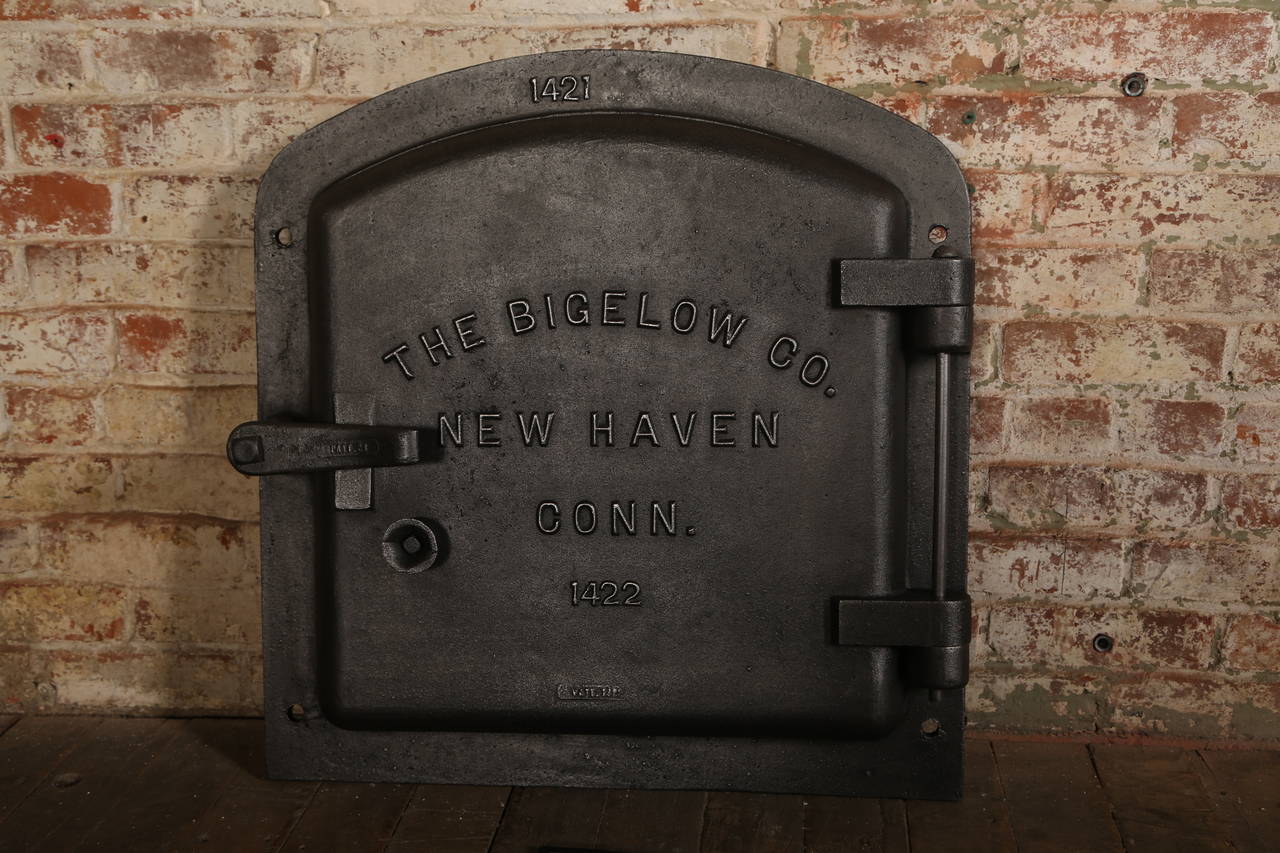 Antique Industrial furniture. Antique Industrial Bigelow boiler door, cast iron wall art sculpture. 