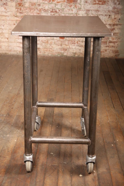 Vintage industrial Turtle Table with a cast iron table top.