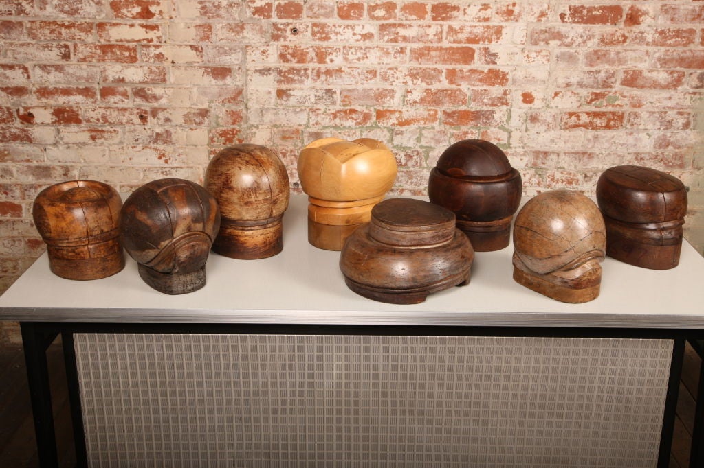 Various vintage industrial wooden hat blocks.  Different shapes and sizes to choose from.  Several are called puzzle blocks that come apart for easy removal of the hat from the block.  Price per item.
