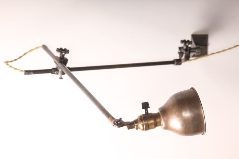 Vintage Industrial O.C. white adjustable wall task light, lamp. Each arm measures 19 1/2