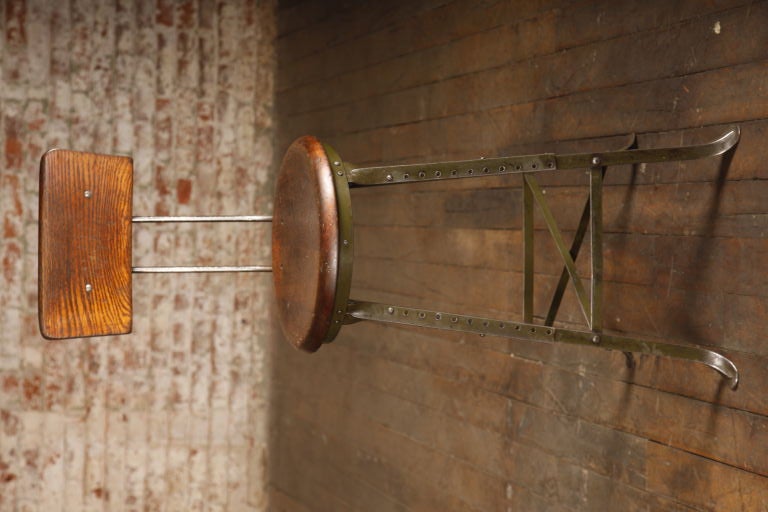 Original Vintage Industrial, American Made Adjustable Stool in original green paint.  Seat diameter is 13 1/2