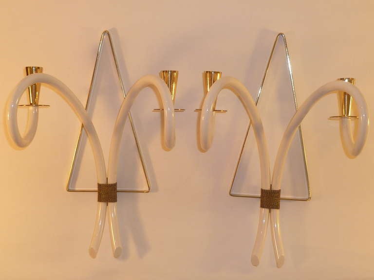 Reduced from $1,850......Wonderfully elegant and chic, 1940s French appliques in polished solid brass and faux ivory, shaped tubular white plexiglas or galalith arms ending in solid brass bobeches and candle cups. Beautifully bound with braided