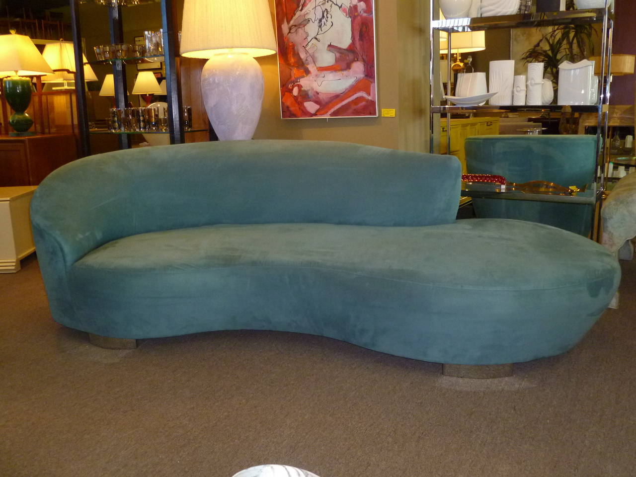 SOLD  In teal blue ultra suede, a Serpentine sofa by Vladimir Kagan for Directional. Original lustrous ultra suede. Chrome curved feet. Very, very nice original condition.

Measurements: 8 feet wide x 45