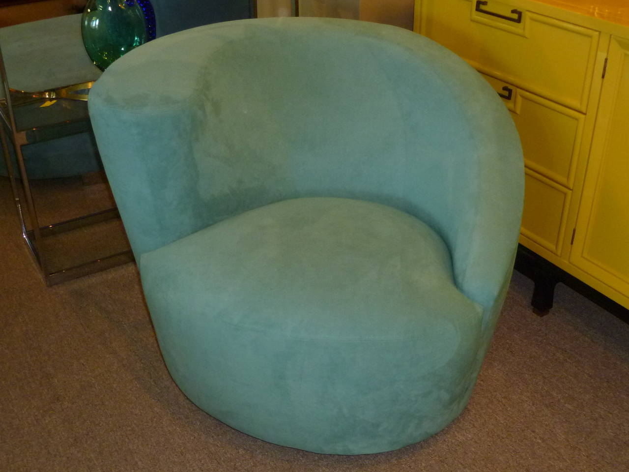 SOLD In teal blue ultra suede, a nautilus chair by Vladimir Kagan for Directional. In excellent condition, no issues. Turns 180 degrees in each direction on a upholstered circular swivel base and returning to the original position. Very comfortable