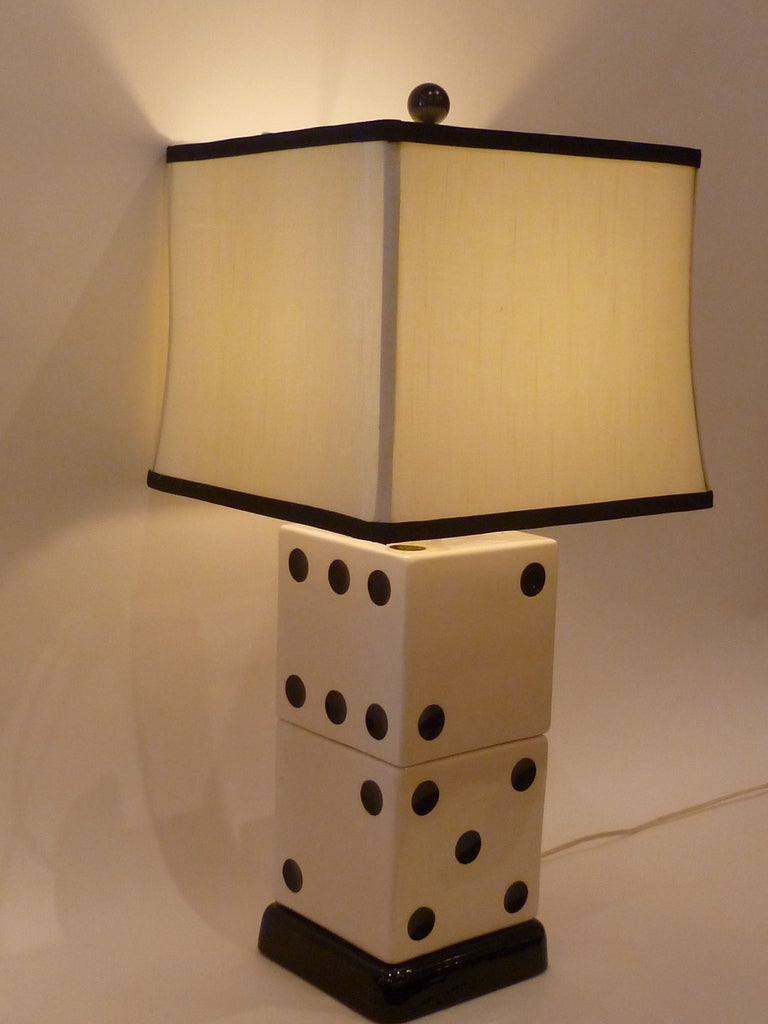 ...SOLD...What's your lucky number?
From the 1950s, this delightful table lamp with coordinated silk shade is a set of large ceramic dice stacked.  The measurement to the socket is 13 1/4
