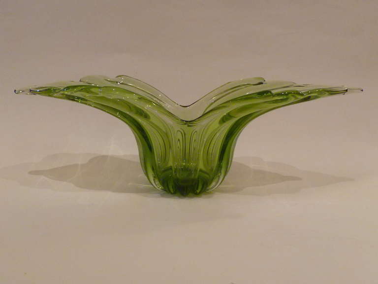 Gorgeous in green and clear blown crystal, this console bowl by Alfredo Barbini and imported by Weil Ceramics & Glass makes a captivating statement as a centerpiece. Glass art by a master, retaining its foil Barbini label. Alfredo Barbini, Venetian,